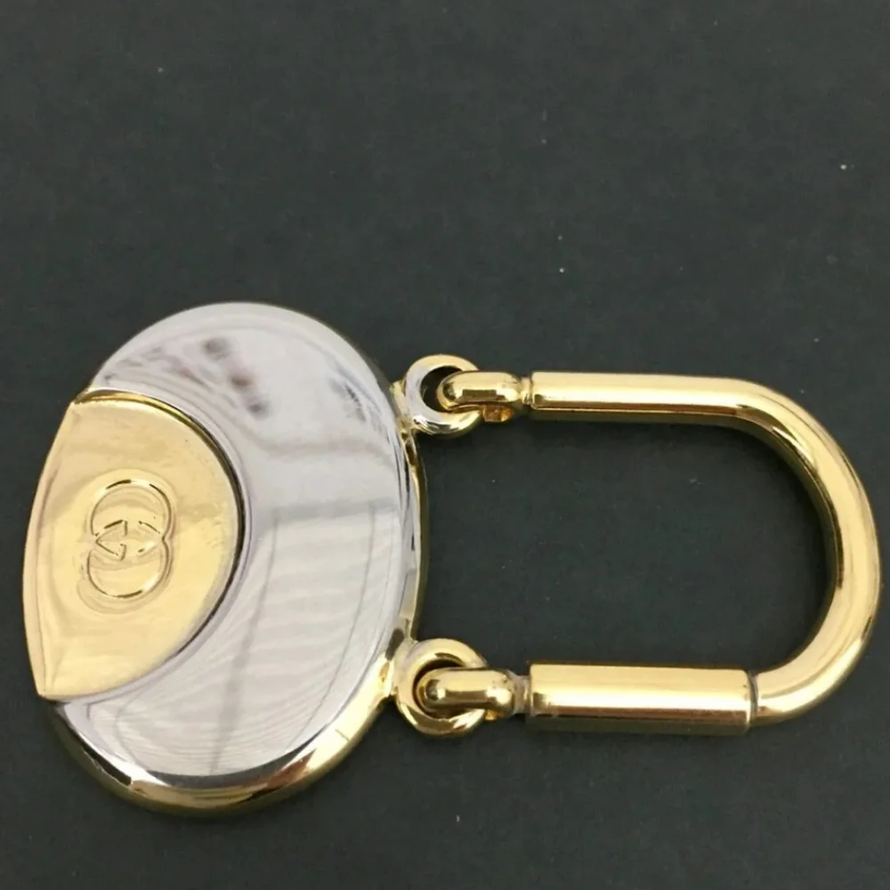 GUCCI INTERLOCKING G SILVER GOLD TONE KEY RING CHARM/UT1930 (UNISEX).